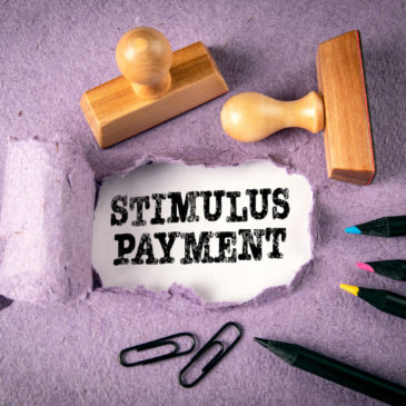 illustration with wooden stamps "stimulus payment"